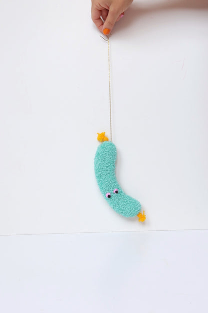Furry Sausage with Eyes - Light Blue and Yellow Textile Art